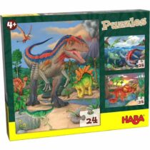 Puzzle de Dinossauros Haba com ilustrações coloridas de dinossauros em ambientes pré-históricos, apresentado numa caixa verde e amarela.